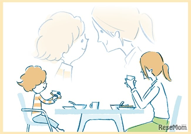 朝食を向き合って食べる親子