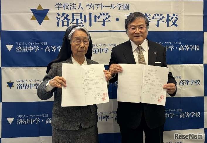 「事業譲渡契約書」に調印