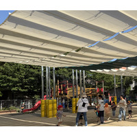 夏でも、子どもたちに外遊びさせてあげたい大型日よけシェード「おひさまカーテン」※を、保育園に無償提供（※）特許出願中